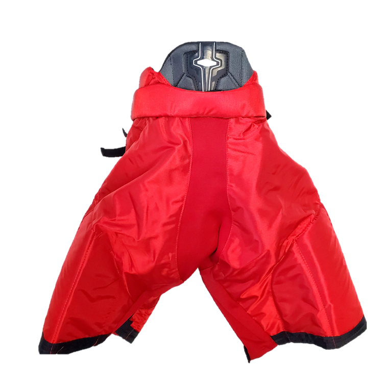 Bauer Nexus - Pantalon de hockey Pro Stock NCAA pour femme (rouge/noir)
